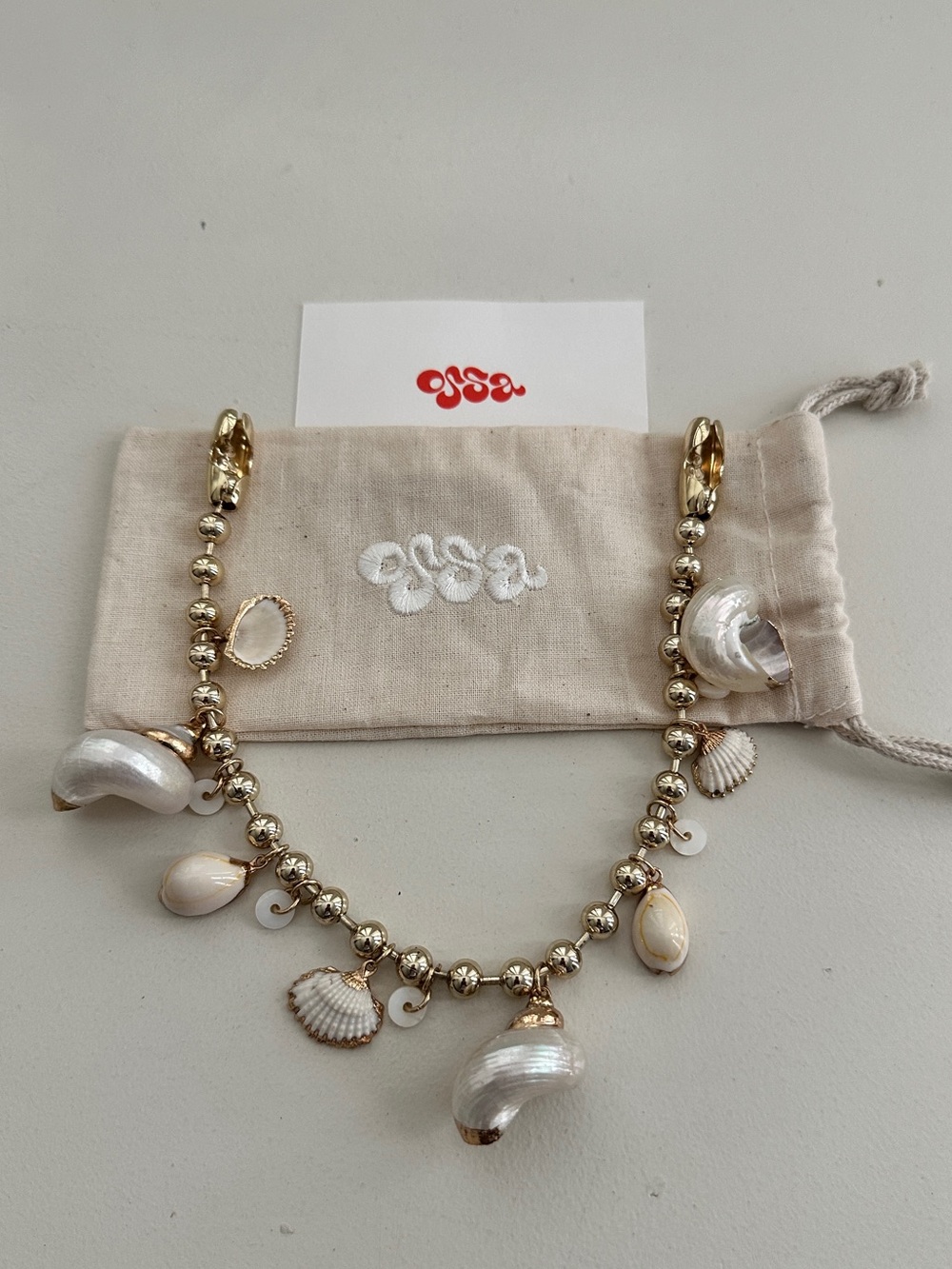 OSSA New York Gold-Tone Dipped Seashells Wristlet